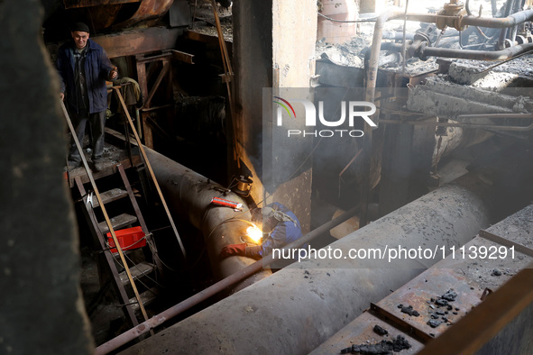 A worker is welding at the Kharkiv Combined Heat and Power Plant (CHP) in the Kharkiv Region, northeastern Ukraine, on April 11, 2024. The p...