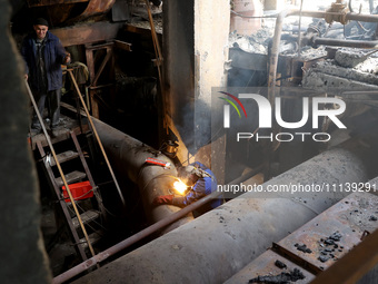 A worker is welding at the Kharkiv Combined Heat and Power Plant (CHP) in the Kharkiv Region, northeastern Ukraine, on April 11, 2024. The p...