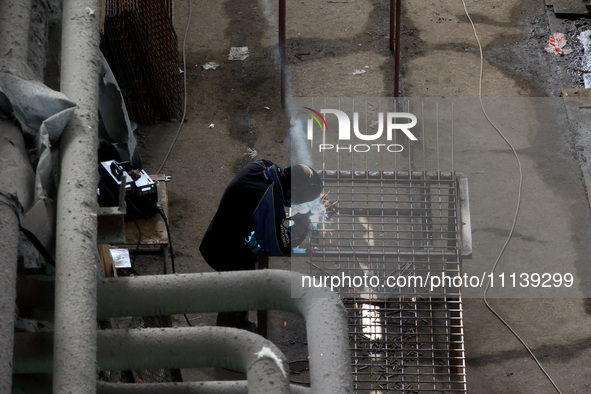 A worker is welding at the Kharkiv Combined Heat and Power Plant (CHP) in the Kharkiv Region, northeastern Ukraine, on April 11, 2024. The p...