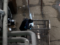 A worker is welding at the Kharkiv Combined Heat and Power Plant (CHP) in the Kharkiv Region, northeastern Ukraine, on April 11, 2024. The p...