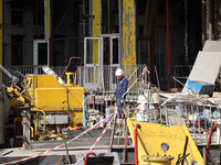 A worker is inspecting the damage at the Kharkiv Combined Heat and Power Plant (CHP) in the Kharkiv Region, northeastern Ukraine, on April 1...