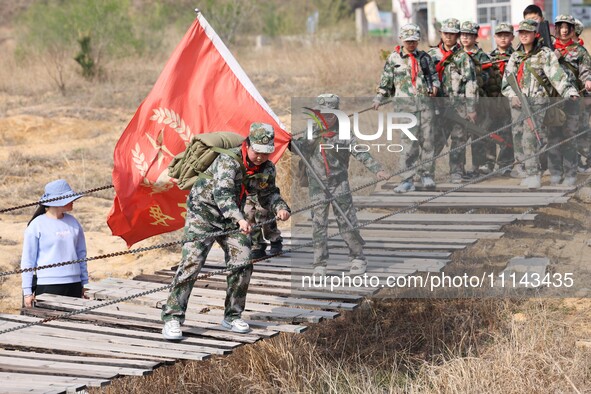 Primary school students are experiencing ''retracing the Long March'' in Lianyungang, Jiangsu Province, China, on April 13, 2024. 