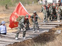 Primary school students are experiencing ''retracing the Long March'' in Lianyungang, Jiangsu Province, China, on April 13, 2024. (