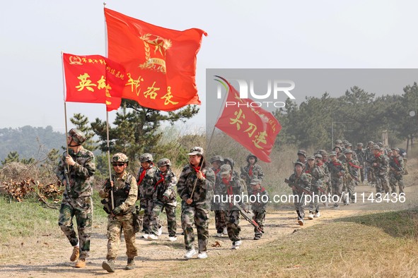 Primary school students are experiencing ''retracing the Long March'' in Lianyungang, Jiangsu Province, China, on April 13, 2024. 