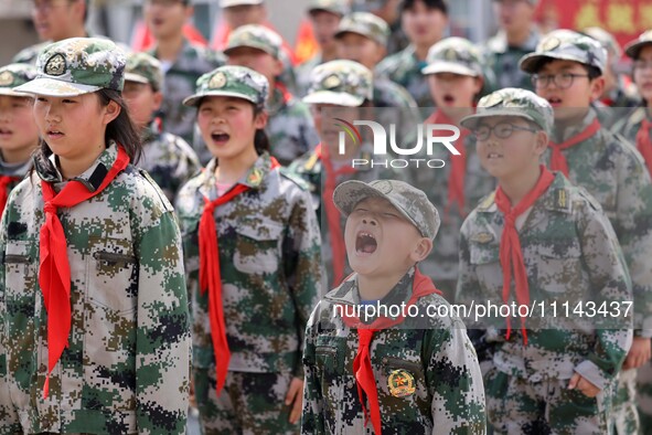 Primary school students are attending a military experience camp in Lianyungang, Jiangsu Province, China, on April 13, 2024. 