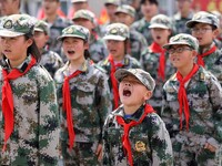 Primary school students are attending a military experience camp in Lianyungang, Jiangsu Province, China, on April 13, 2024. (