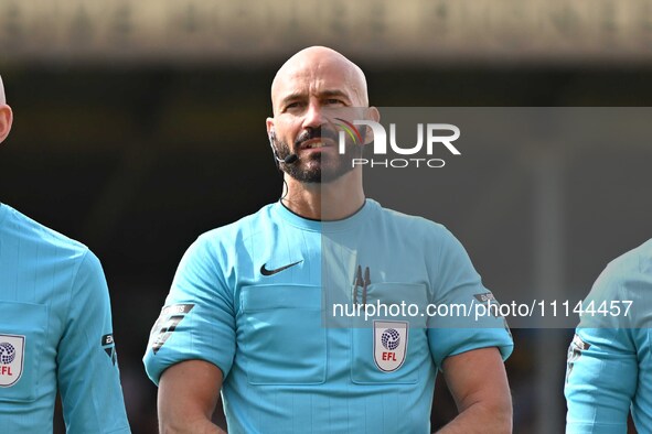 Referee Darren Drysdale is looking on during the Sky Bet League 1 match between Cambridge United and Charlton Athletic at the Cledara Abbey...