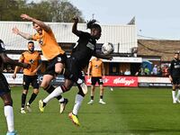Danny Andrew of Cambridge United and Karoy Anderson of Charlton Athletic are challenging for the ball during the Sky Bet League 1 match betw...