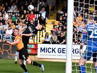 Liam Bennet of Cambridge United is challenging George Dobson of Charlton Athletic during the Sky Bet League 1 match between Cambridge United...