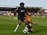 James Gibbons of Cambridge United is being challenged by Tyreece Campbell of Charlton Athletic during the Sky Bet League 1 match at the Cled...