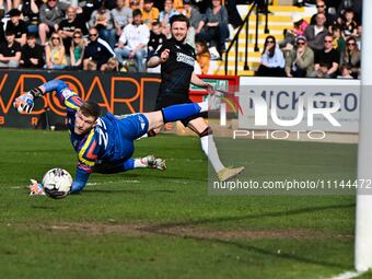 Players from Cambridge United and Charlton Athletic are competing during the Sky Bet League 1 match at the Cledara Abbey Stadium in Cambridg...