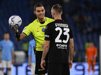 Referee Luca Zufferli and Norbert Gyomber of U.S. Salernitana 1919 are seen during the 32nd day of the Serie A Championship between S.S. Laz...