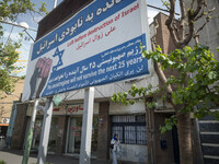 An Iranian woman is walking under an anti-Israeli billboard in downtown Tehran, Iran, on April 13, 2024. The Prime Minister of Israel, Benja...