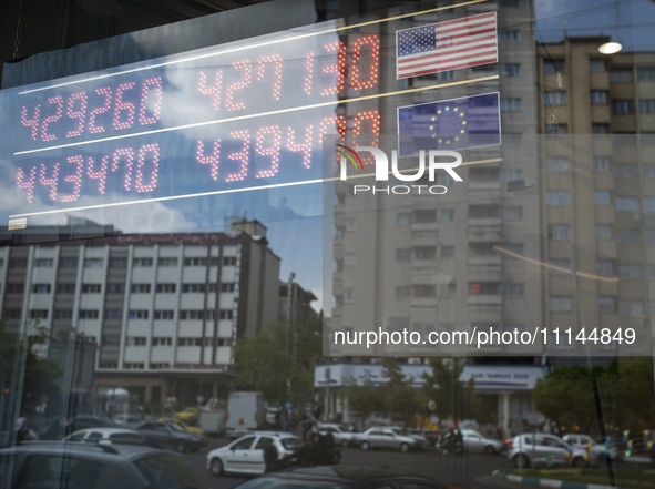 An electronic board is being displayed at a currency exchange shop in Tehran's business district, Iran, on April 13, 2024. The Prime Ministe...