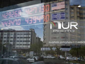 An electronic board is being displayed at a currency exchange shop in Tehran's business district, Iran, on April 13, 2024. The Prime Ministe...