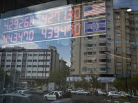 An electronic board is being displayed at a currency exchange shop in Tehran's business district, Iran, on April 13, 2024. The Prime Ministe...