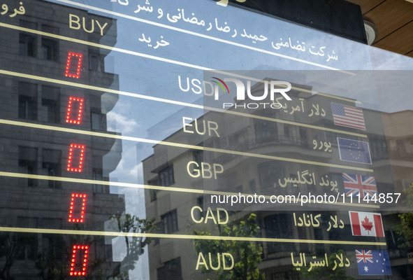 An electronic board is being displayed at a currency exchange shop in Tehran's business district, Iran, on April 13, 2024. The Prime Ministe...