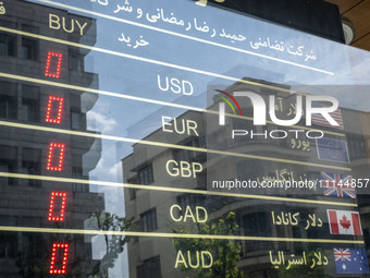 An electronic board is being displayed at a currency exchange shop in Tehran's business district, Iran, on April 13, 2024. The Prime Ministe...