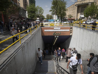 Iranian shoppers are walking out of an underground station near the Grand Bazaar in southern Tehran, Iran, on April 13, 2024. The Prime Mini...