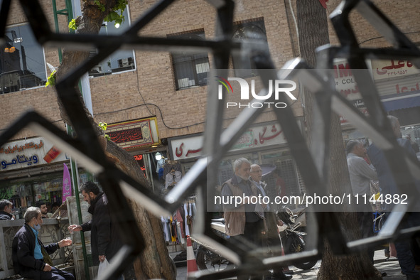 Iranian men are standing together on a street near the Grand Bazaar in southern Tehran, Iran, on April 13, 2024. The Prime Minister of Israe...