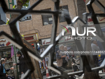 Iranian men are standing together on a street near the Grand Bazaar in southern Tehran, Iran, on April 13, 2024. The Prime Minister of Israe...