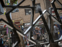 Iranian men are standing together on a street near the Grand Bazaar in southern Tehran, Iran, on April 13, 2024. The Prime Minister of Israe...