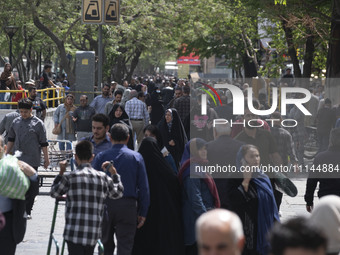 Iranian shoppers are walking along a street near the Grand Bazaar in southern Tehran, Iran, on April 13, 2024. The Prime Minister of Israel,...