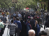 Iranian shoppers are walking along a street near the Grand Bazaar in southern Tehran, Iran, on April 13, 2024. The Prime Minister of Israel,...