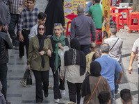 Iranian shoppers are walking along a street near the Grand Bazaar in southern Tehran, Iran, on April 13, 2024. The Prime Minister of Israel,...