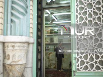 An Iranian man is praying at a small mosque near the Grand Bazaar in southern Tehran, Iran, on April 13, 2024. Meanwhile, the Prime Minister...