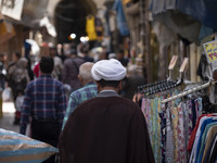 An Iranian cleric is walking along a street near the Grand Bazaar in southern Tehran, Iran, on April 13, 2024. Meanwhile, the Prime Minister...