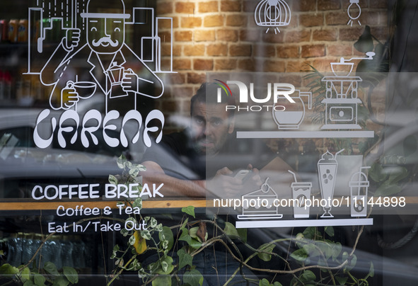 An Iranian man is sitting at a cafe and looking on in downtown Tehran, Iran, on April 13, 2024. The Prime Minister of Israel, Benjamin Netan...