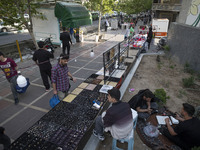 An Iranian man is standing next to a vendor on a sidewalk in downtown Tehran, Iran, on April 13, 2024. The Prime Minister of Israel, Benjami...