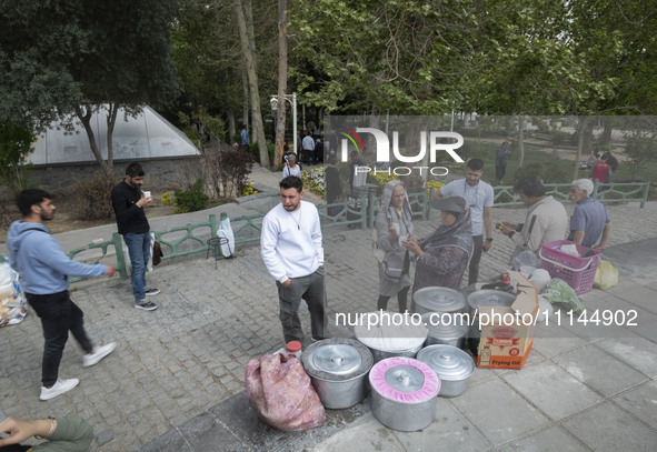 People and vendors are gathering at a park in downtown Tehran, Iran, on April 13, 2024. The Prime Minister of Israel, Benjamin Netanyahu, is...