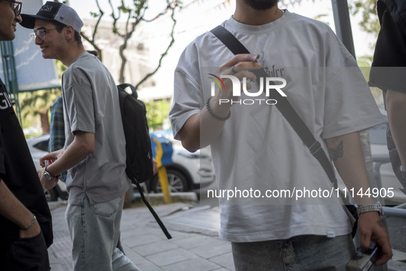 Iranian art students are standing together on a sidewalk in downtown Tehran, Iran, on April 13, 2024. The Prime Minister of Israel, Benjamin...