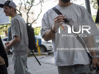 Iranian art students are standing together on a sidewalk in downtown Tehran, Iran, on April 13, 2024. The Prime Minister of Israel, Benjamin...