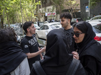 Iranian art students are standing together on a sidewalk in downtown Tehran, Iran, on April 13, 2024. The Prime Minister of Israel, Benjamin...