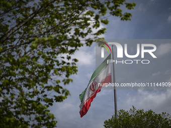 An Iranian flag is waving in downtown Tehran, Iran, on April 13, 2024. The Prime Minister of Israel, Benjamin Netanyahu, is threatening Iran...