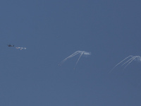 An Israeli Air Force attack helicopter is releasing flares during a flyover above the Gaza Strip on April 14, 2024, amid ongoing battles in...