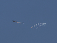 An Israeli Air Force attack helicopter is releasing flares during a flyover above the Gaza Strip on April 14, 2024, amid ongoing battles in...