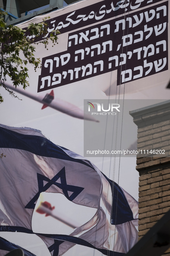 An anti-Israeli mural, which illustrates appreciation for the IRGC missile and UAV attack on Israel, is being displayed on a governmental bu...