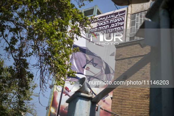 An anti-Israeli mural, which illustrates appreciation for the IRGC missile and UAV attack on Israel, is being displayed on a governmental bu...