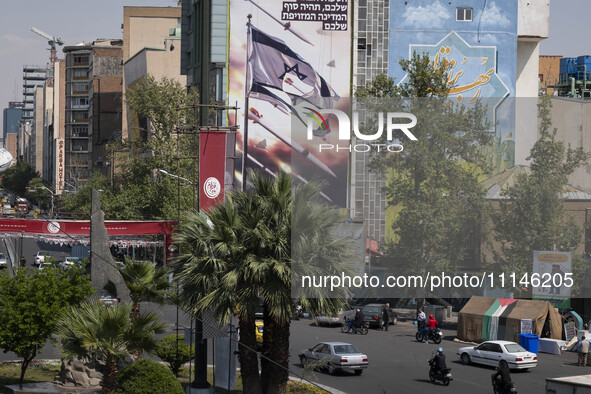 An anti-Israeli mural, which illustrates appreciation for the IRGC missile and UAV attack on Israel, is being displayed on a governmental bu...