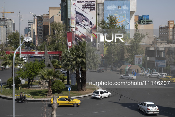 An anti-Israeli mural, which illustrates appreciation for the IRGC missile and UAV attack on Israel, is being displayed on a governmental bu...