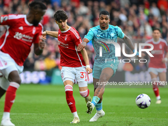 Rodrigo Ribeiro of Nottingham Forest is under pressure from Mario Lemina of Wolverhampton Wanderers during the Premier League match between...