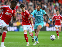 Rodrigo Ribeiro of Nottingham Forest is under pressure from Mario Lemina of Wolverhampton Wanderers during the Premier League match between...