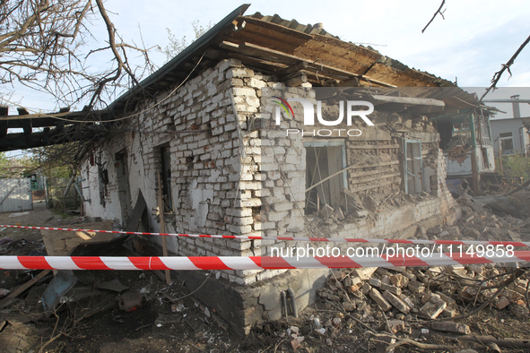 A private house is being damaged by the fall of Russian missile fragments in Dnipro, Ukraine, on April 15, 2024. 