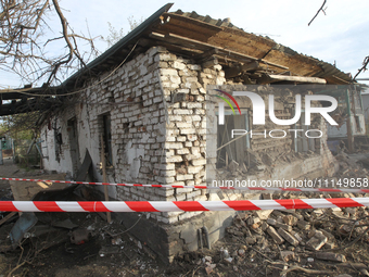 A private house is being damaged by the fall of Russian missile fragments in Dnipro, Ukraine, on April 15, 2024. (