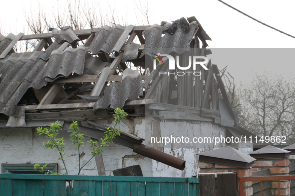 A private house is being damaged by the fall of Russian missile fragments in Dnipro, Ukraine, on April 15, 2024. 