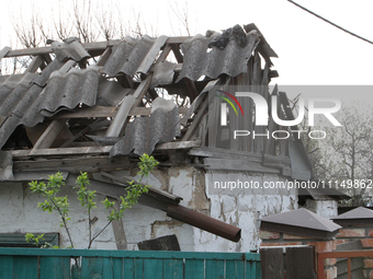 A private house is being damaged by the fall of Russian missile fragments in Dnipro, Ukraine, on April 15, 2024. (